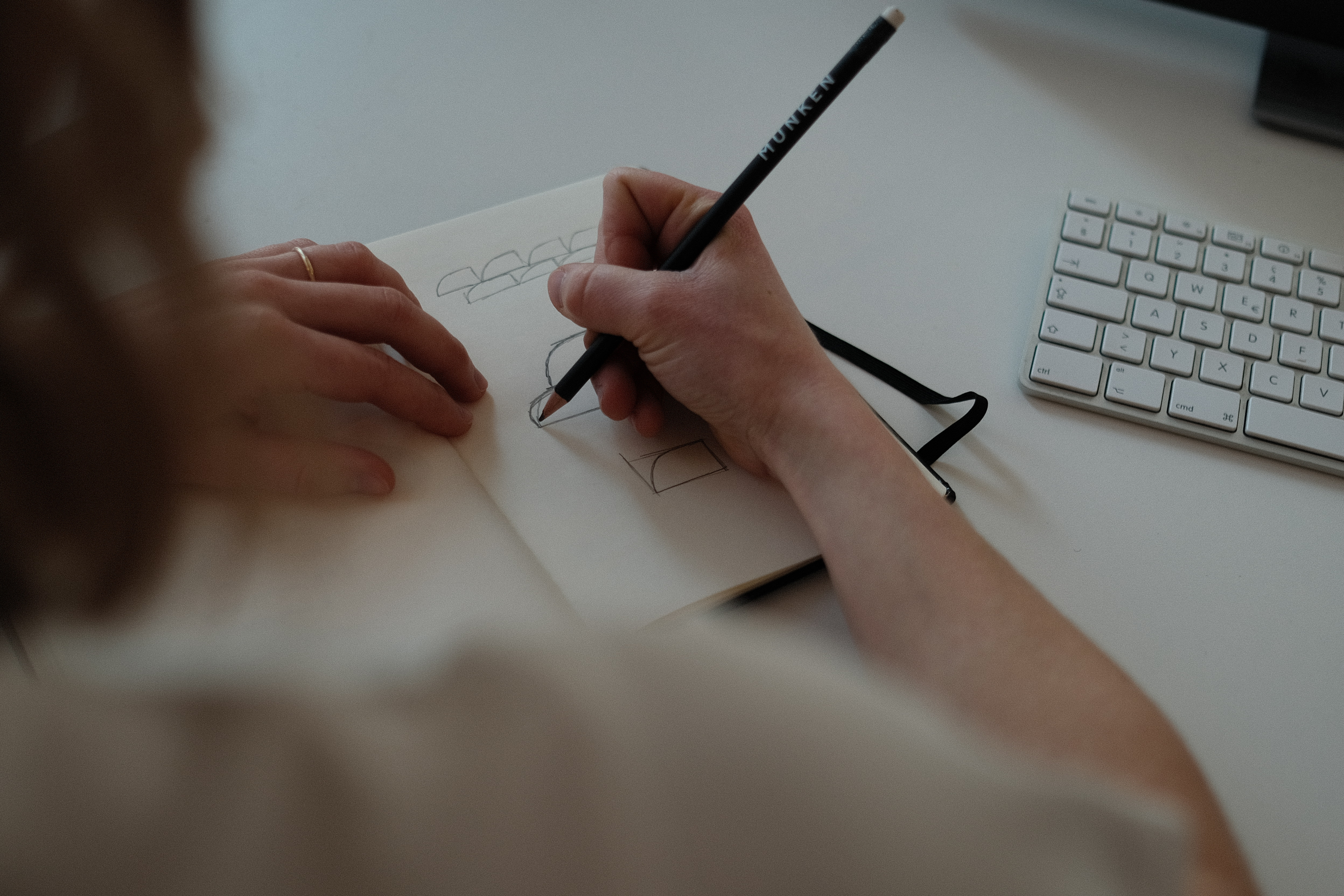 Stationery design of letterhead and business cards for the company Anders on top of a blurred photo of a house interior.